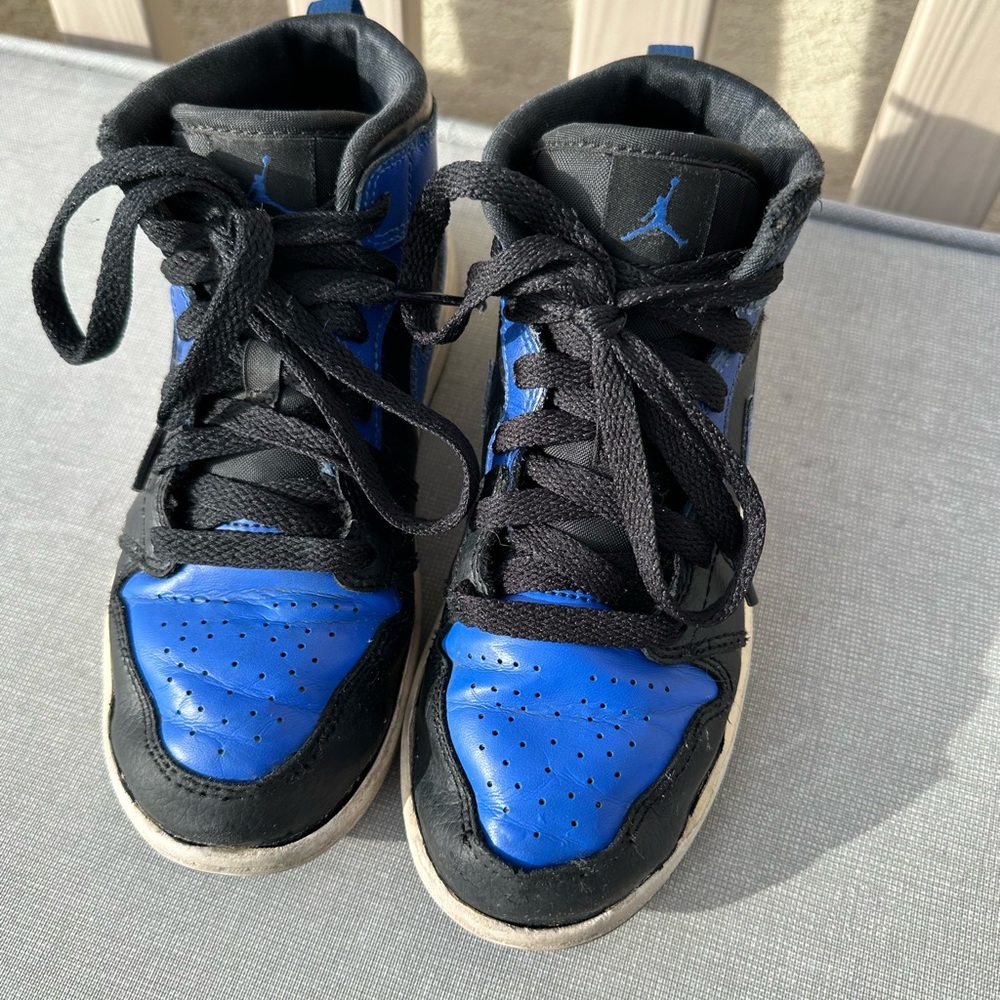 Blue and black Jordan 1. These are very used but were well loved!